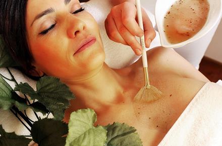 A woman is receiving a wellness treatment